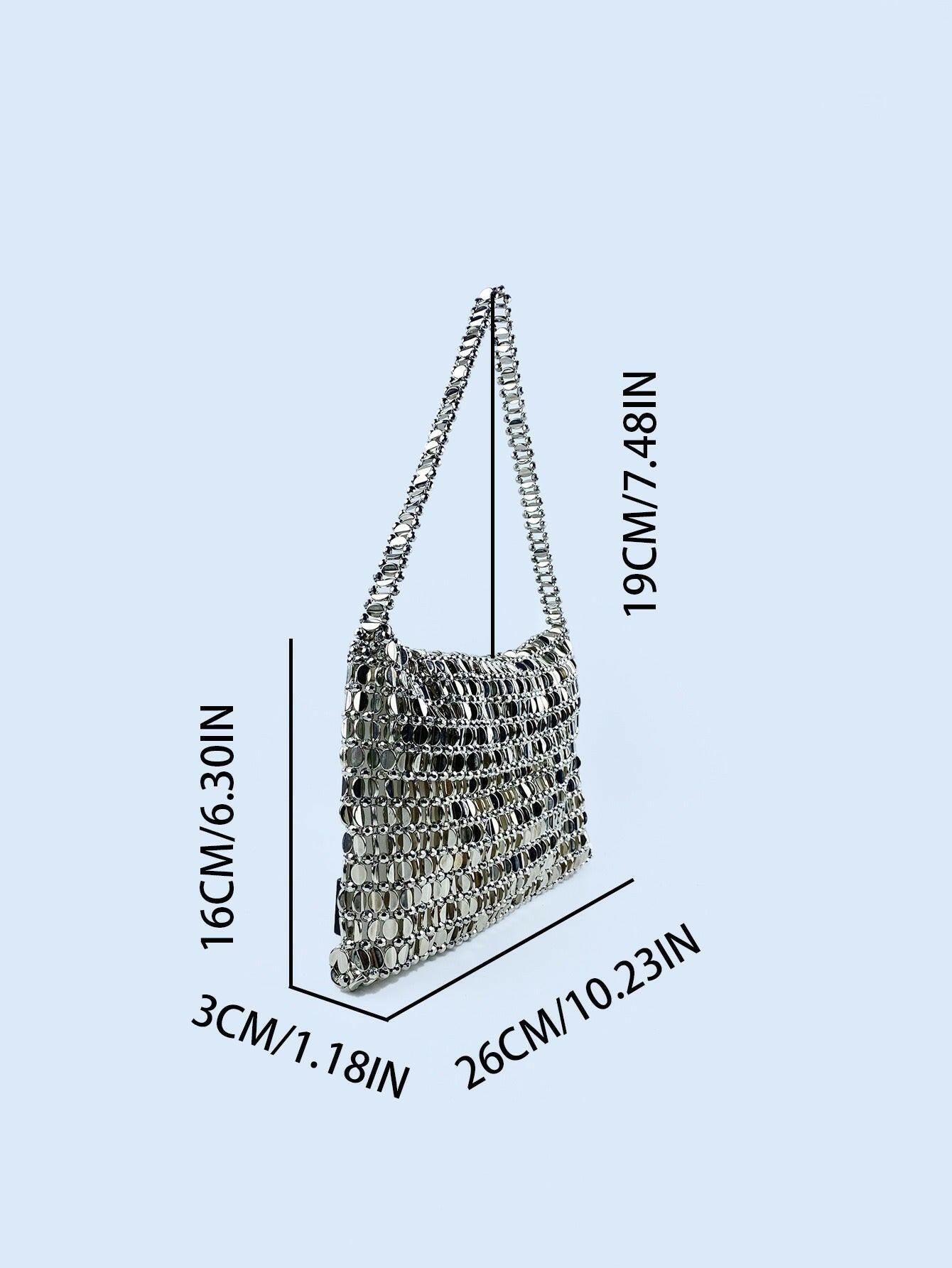 Body shaper and trackuit set paired with a stylish silver bag for a sleek, fashionable look