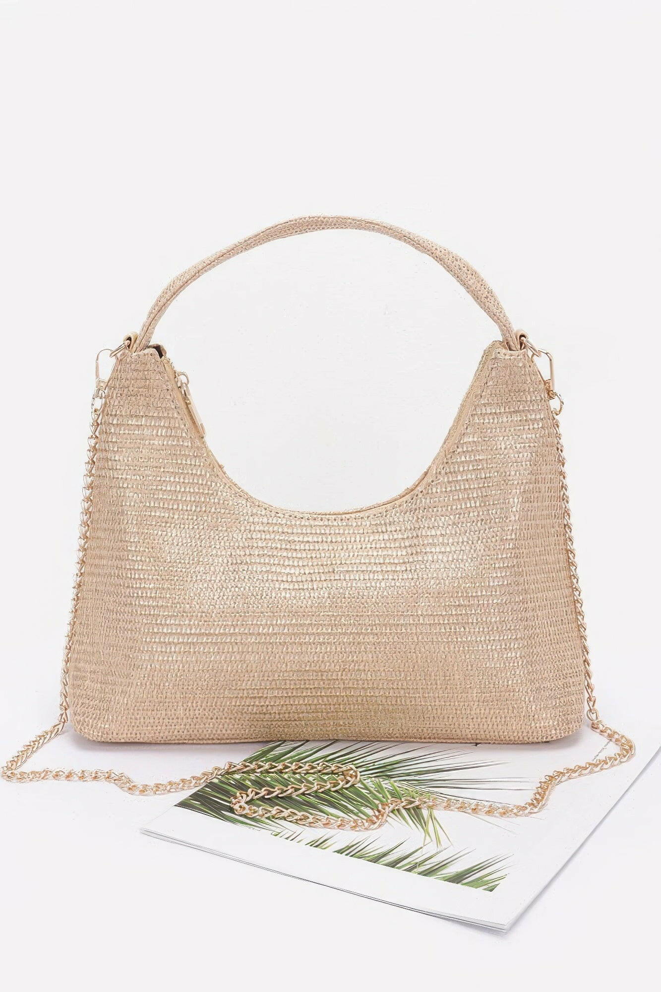 Elegant brown leather hobo bag with adjustable strap, perfect for stylish everyday use and versatile fashion statements.