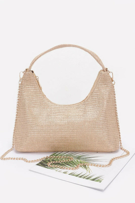 Elegant brown leather hobo bag with adjustable strap, perfect for stylish everyday use and versatile fashion statements.