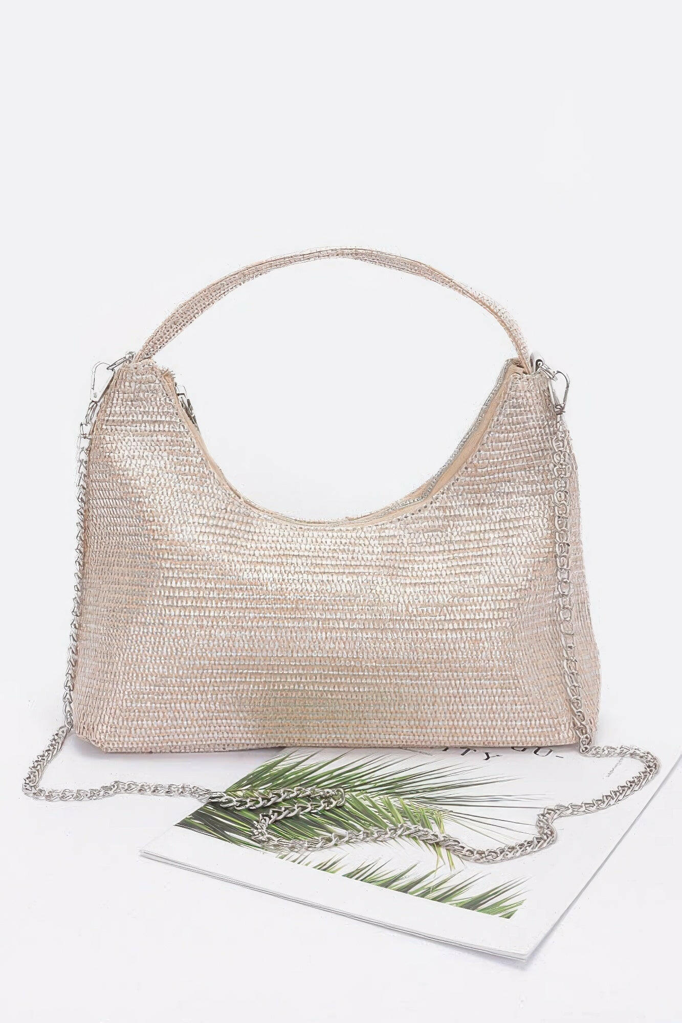 Elegant brown leather hobo bag with adjustable strap, perfect for stylish everyday use and versatile fashion statements.