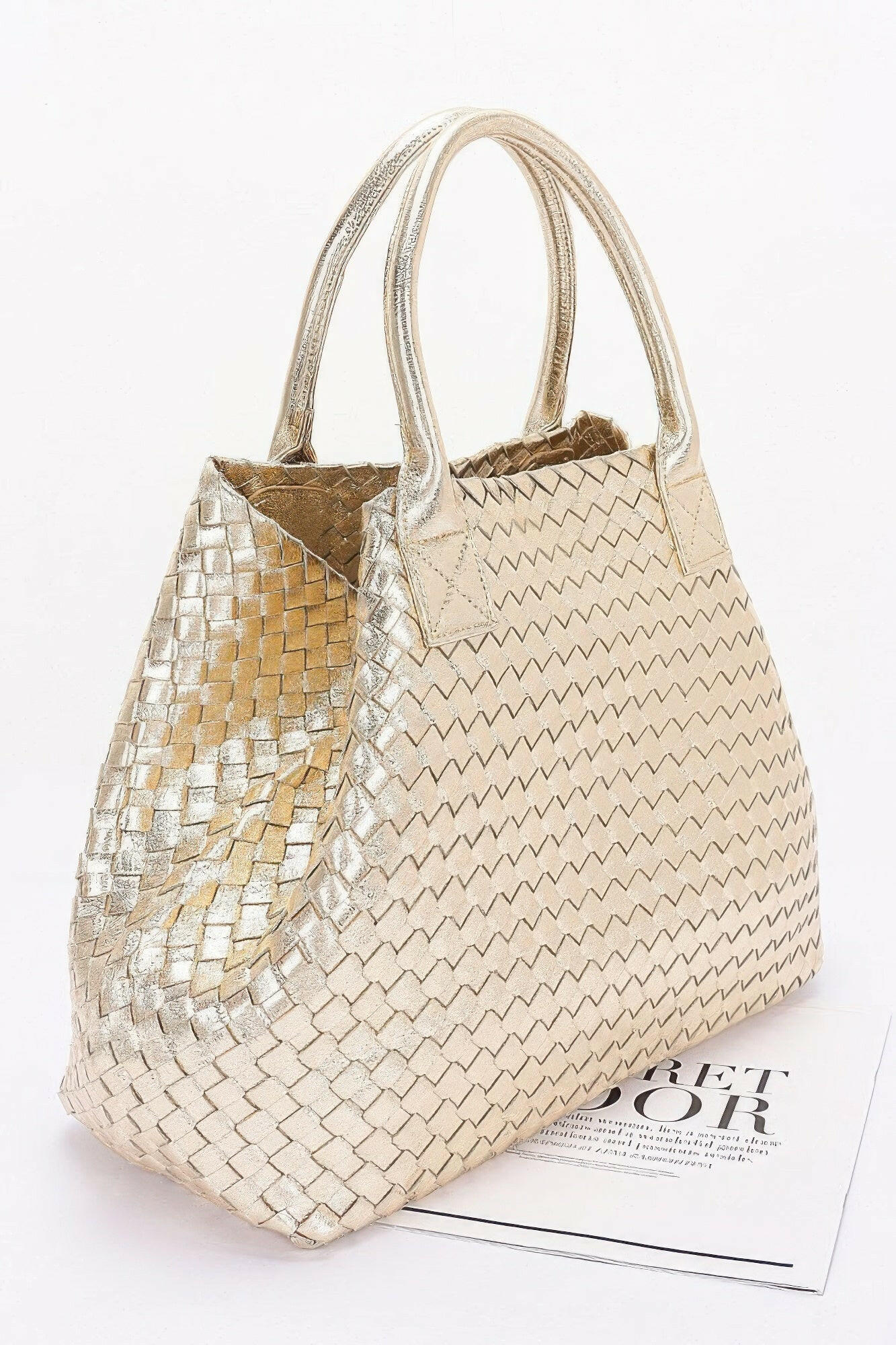 Elegant braided tote bag made from premium materials, perfect for stylish and practical everyday use.