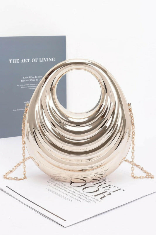 Shiny metallic acrylic bag showcasing modern design, ideal for fashion-forward individuals seeking elegant accessories.