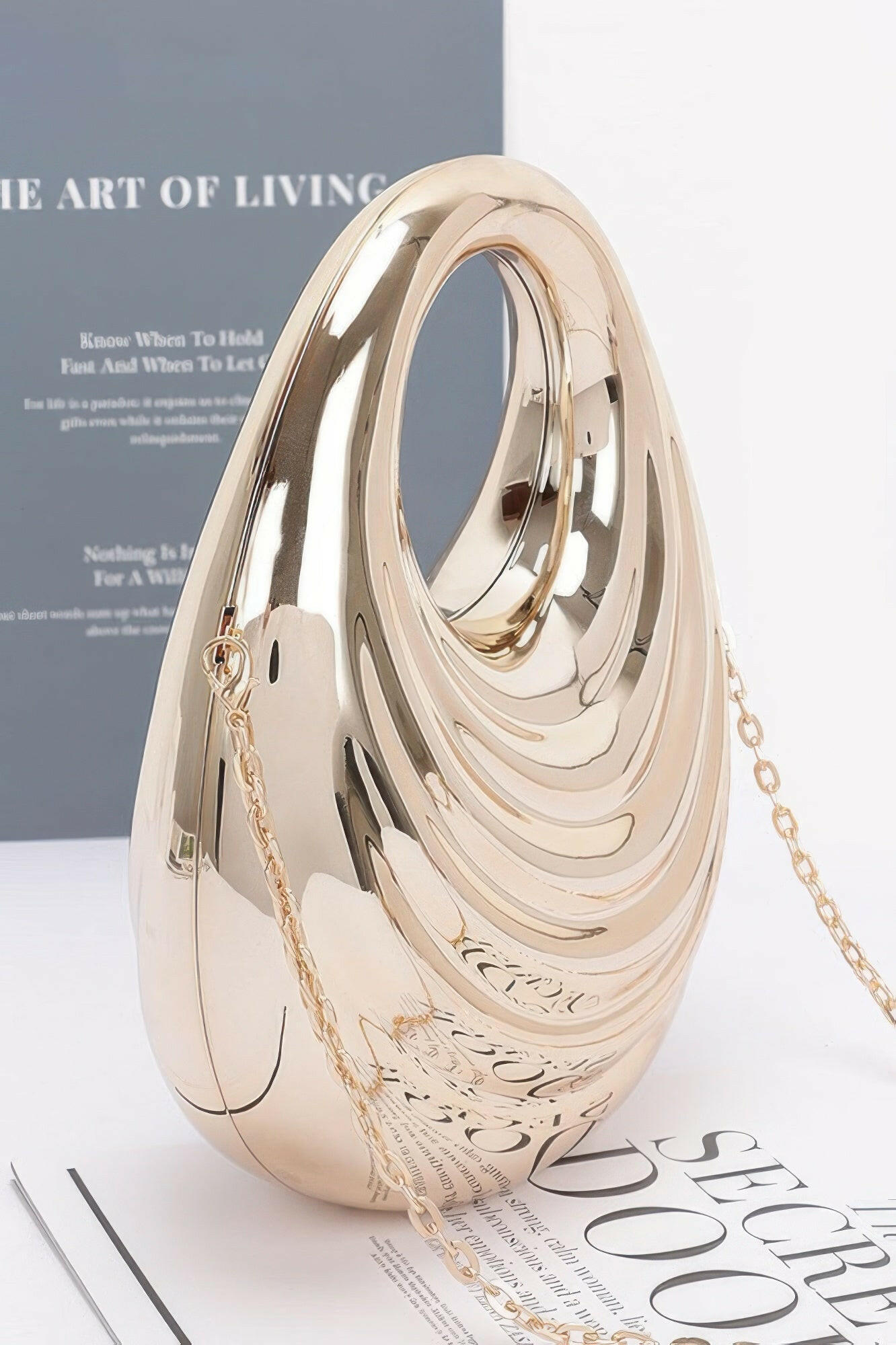 Shiny metallic acrylic bag showcasing modern design, ideal for fashion-forward individuals seeking elegant accessories.