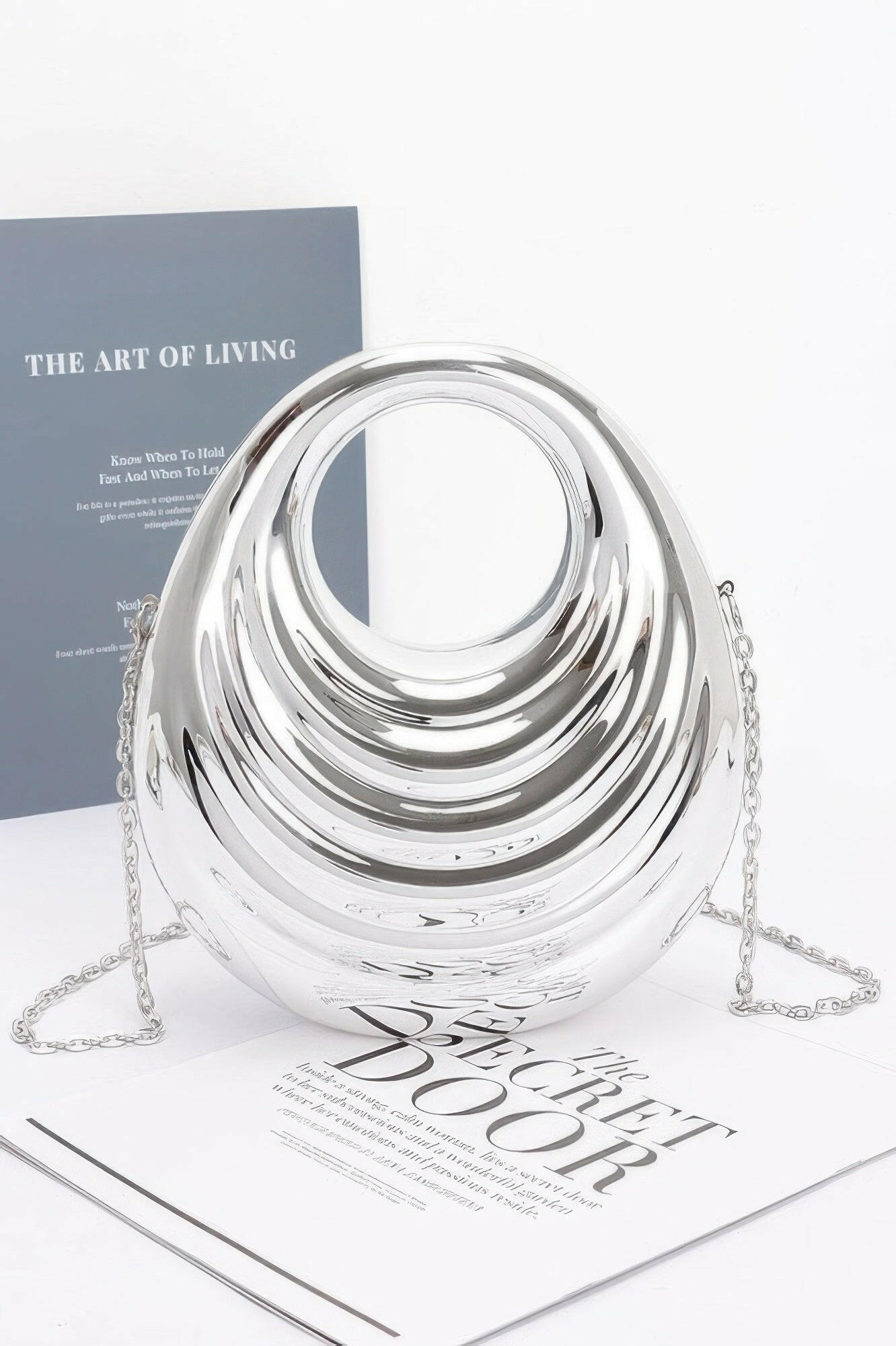 Shiny metallic acrylic bag showcasing modern design, ideal for fashion-forward individuals seeking elegant accessories.