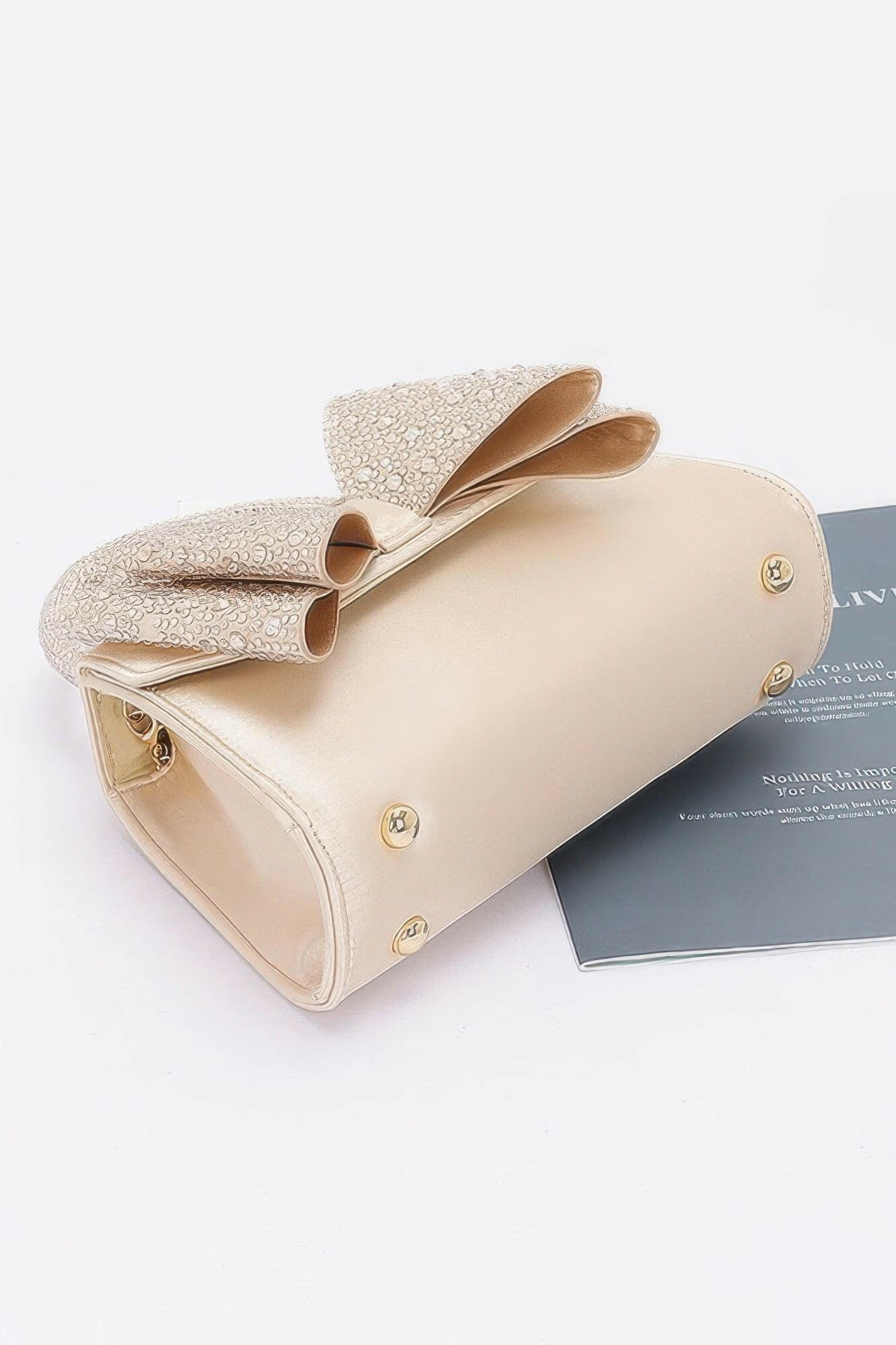 Elegant satin flap bag with refined design, perfect for formal occasions and stylish evening wear.