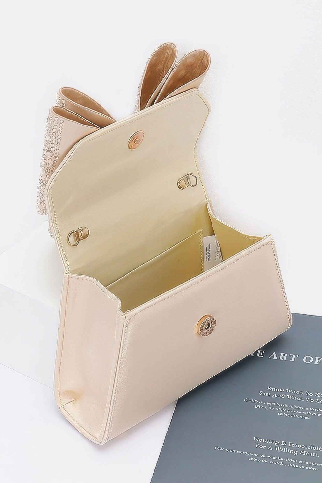 Elegant satin flap bag with refined design, perfect for formal occasions and stylish evening wear.