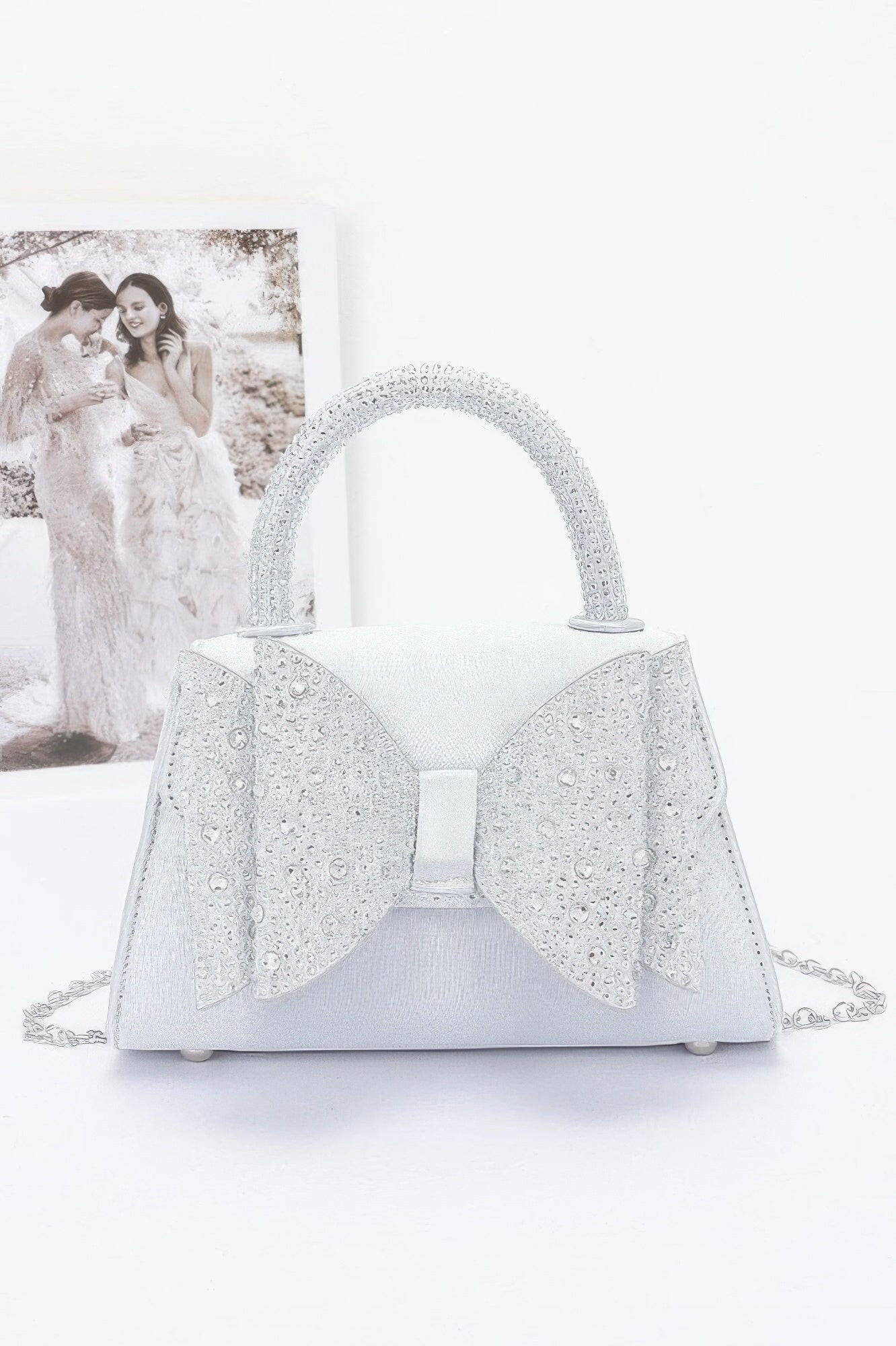 Elegant satin flap bag with refined design, perfect for formal occasions and stylish evening wear.